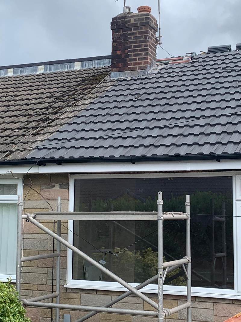 New dark concrete tile roof and chimney on a bungalow in Bolton